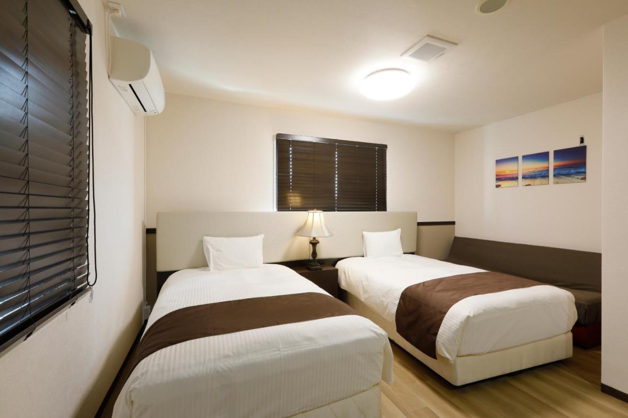 Phoenix Park Hotel Nago Buitenkant foto