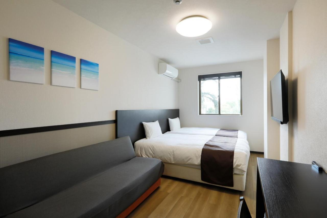 Phoenix Park Hotel Nago Buitenkant foto