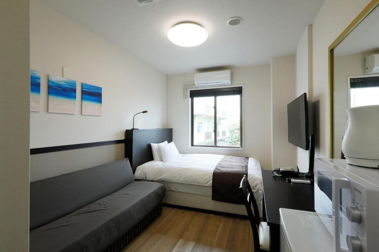 Phoenix Park Hotel Nago Buitenkant foto