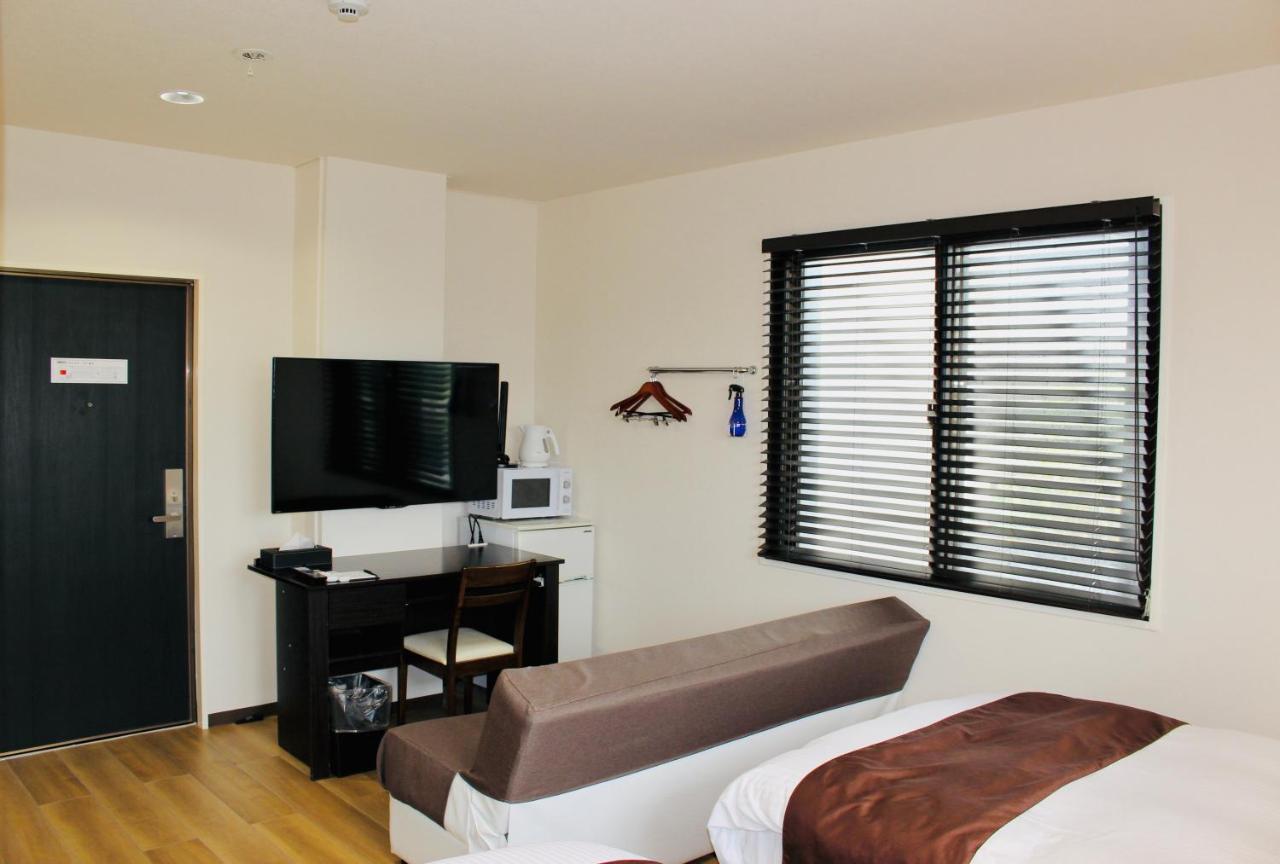 Phoenix Park Hotel Nago Buitenkant foto