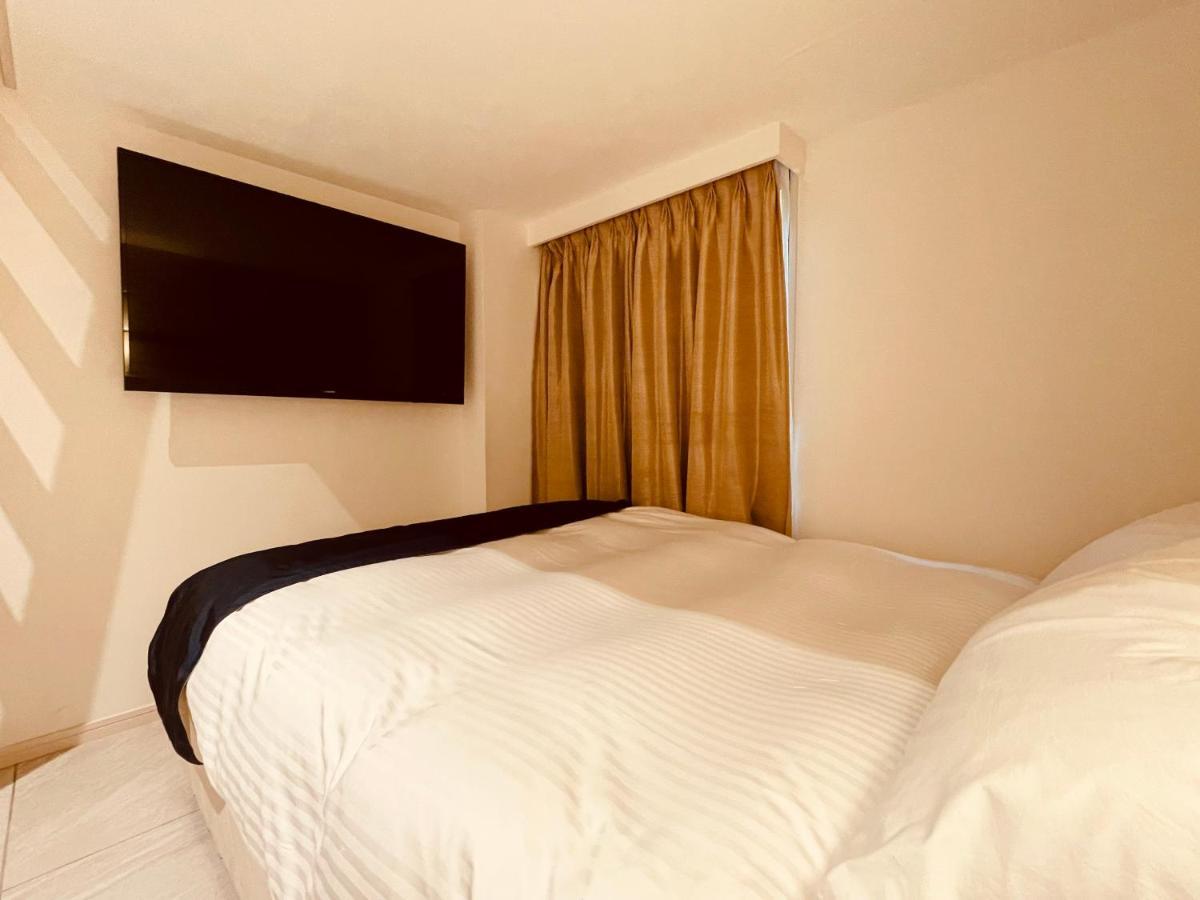 Phoenix Park Hotel Nago Buitenkant foto