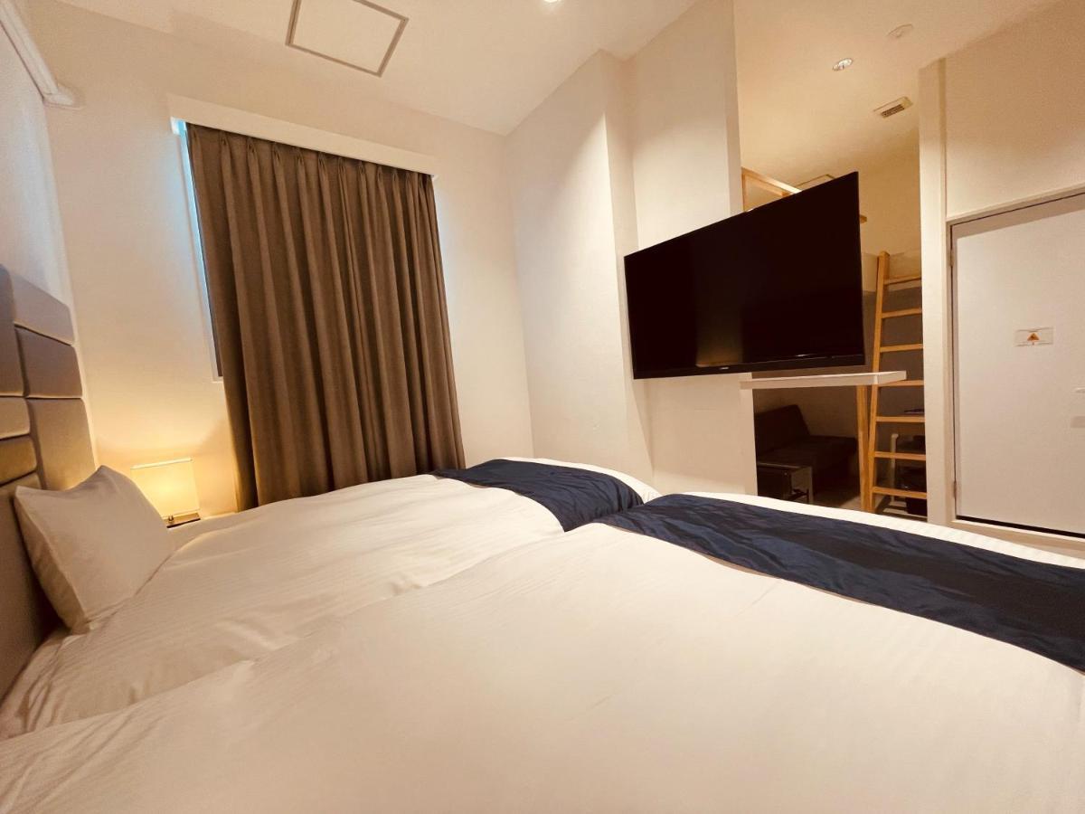 Phoenix Park Hotel Nago Buitenkant foto