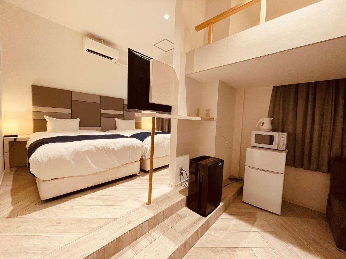 Phoenix Park Hotel Nago Buitenkant foto