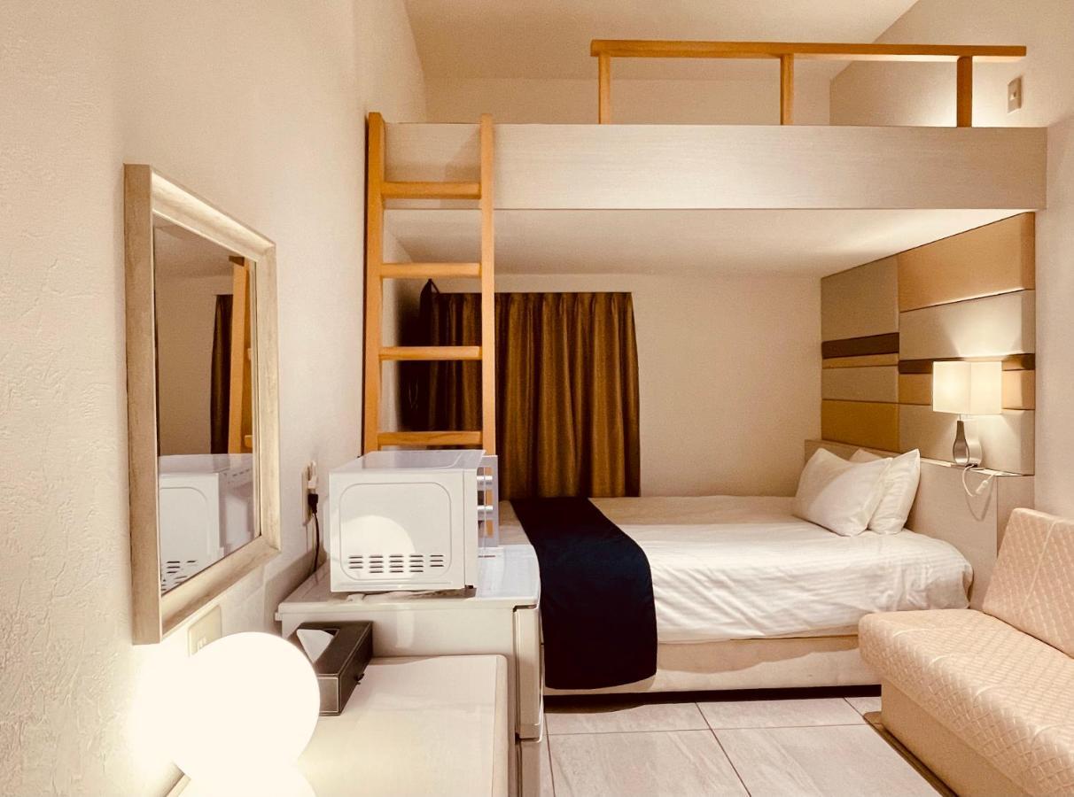 Phoenix Park Hotel Nago Buitenkant foto