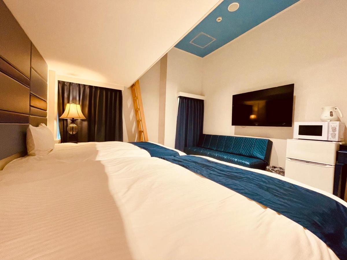 Phoenix Park Hotel Nago Buitenkant foto