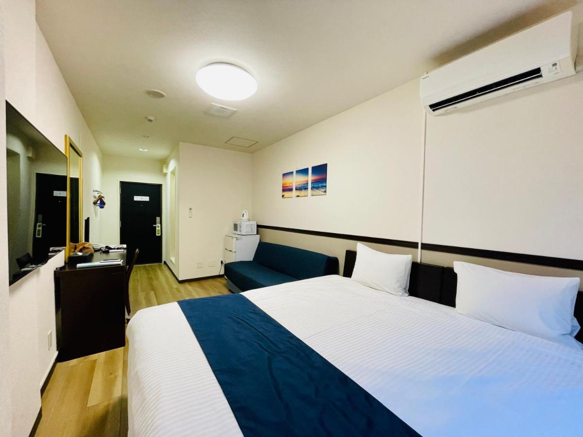 Phoenix Park Hotel Nago Buitenkant foto