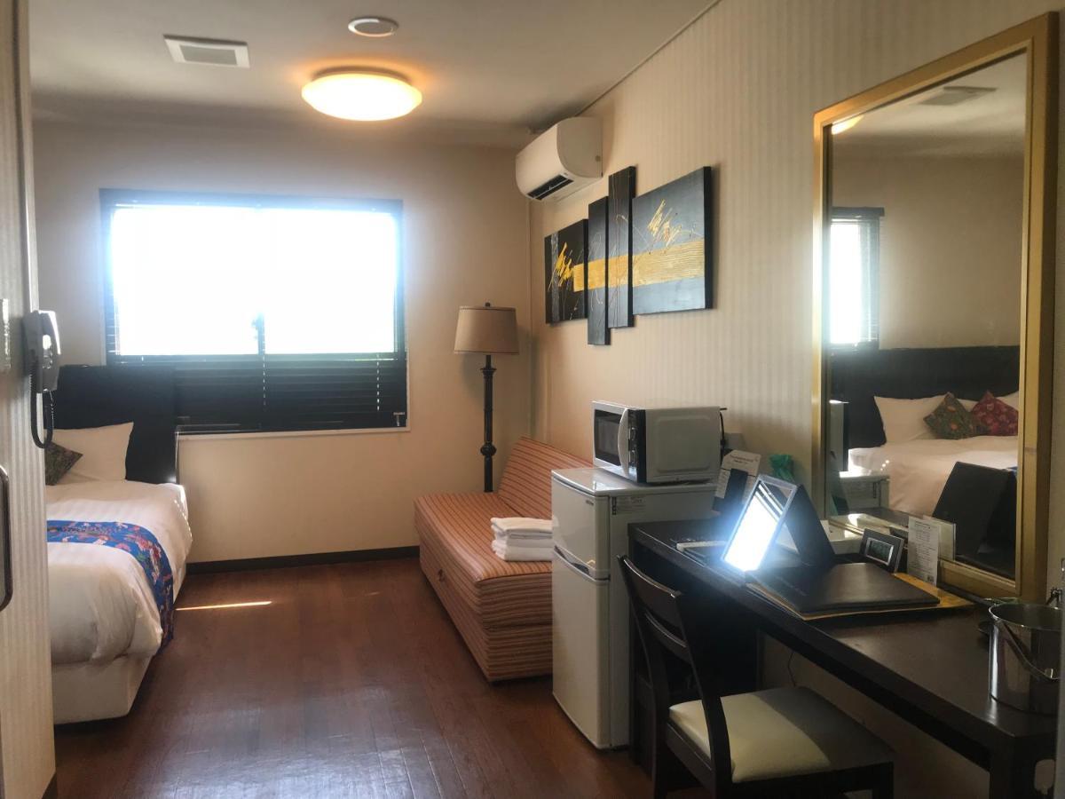 Phoenix Park Hotel Nago Buitenkant foto