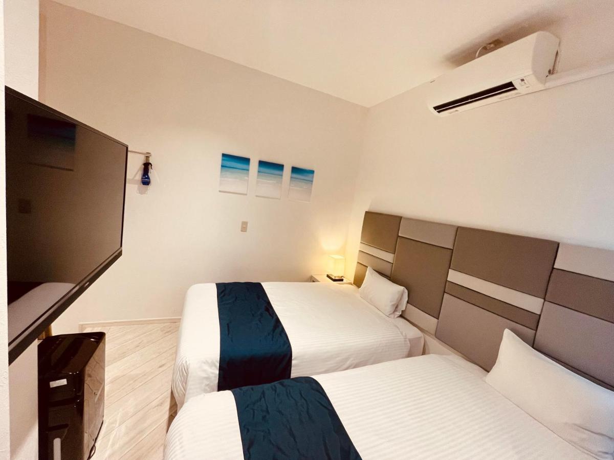 Phoenix Park Hotel Nago Buitenkant foto