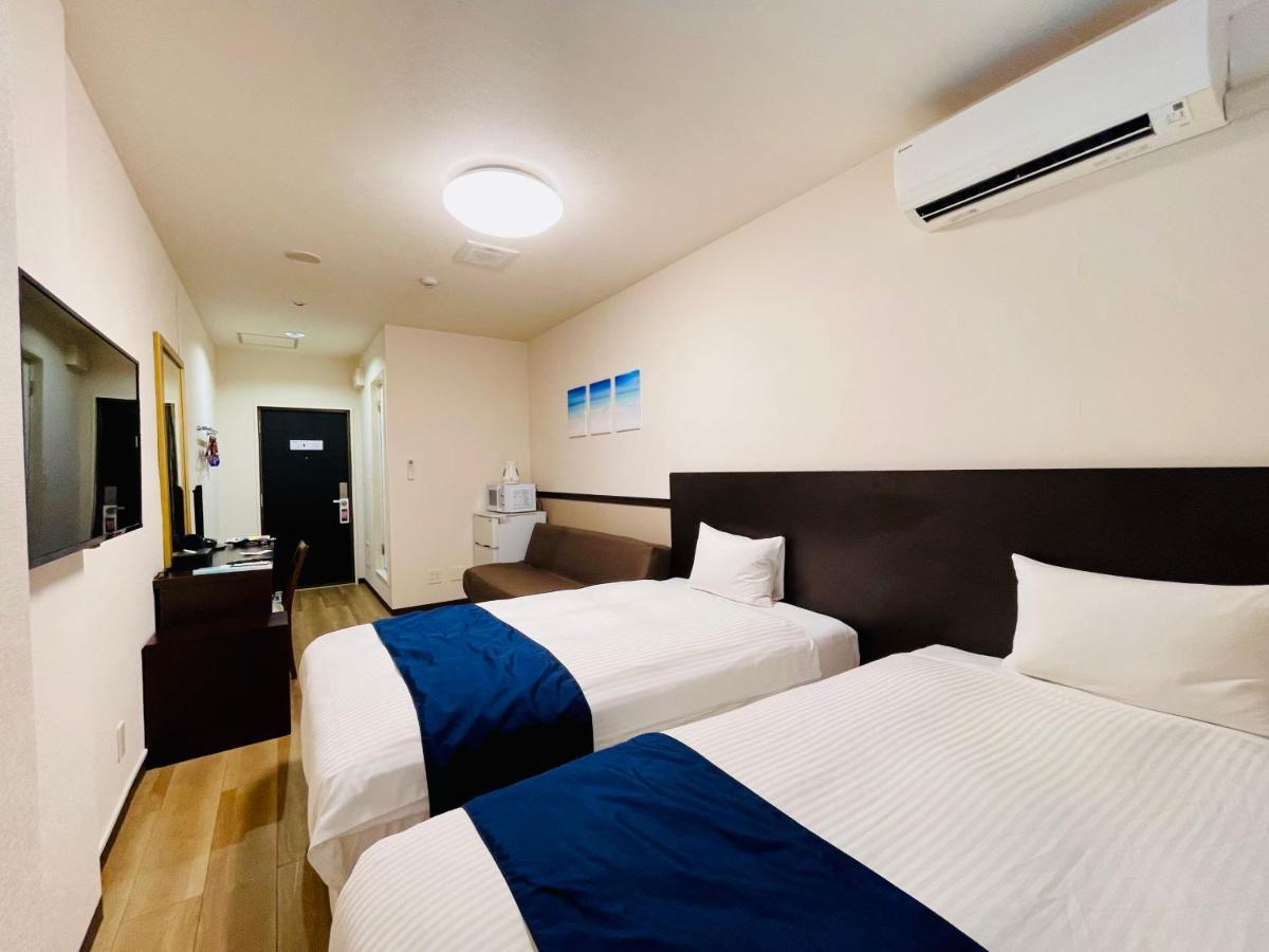 Phoenix Park Hotel Nago Buitenkant foto