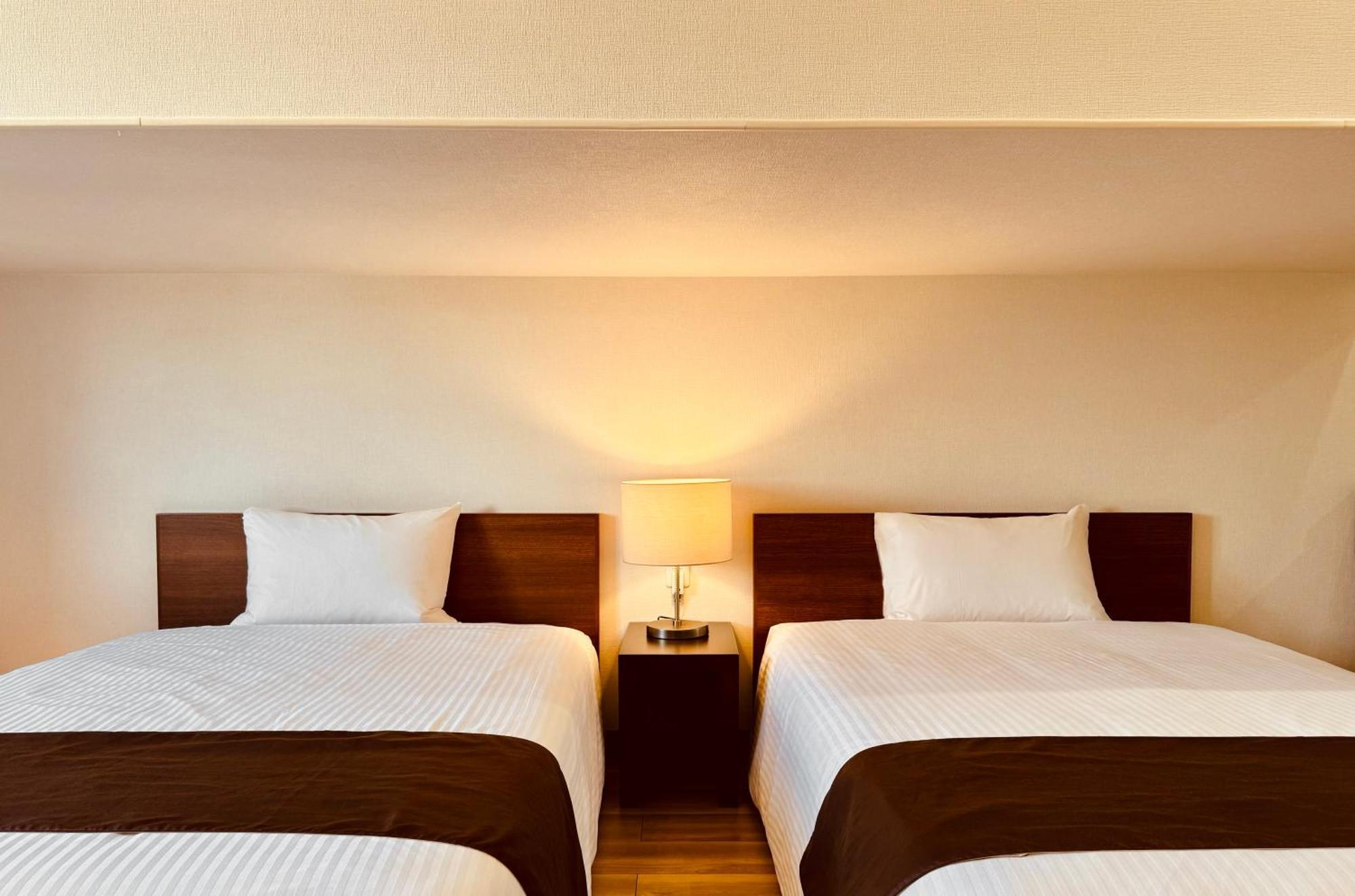 Phoenix Park Hotel Nago Buitenkant foto